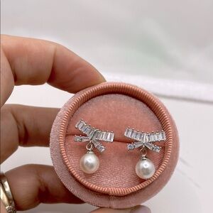 Sterling silver baguette cz and pearl drop bow earrings